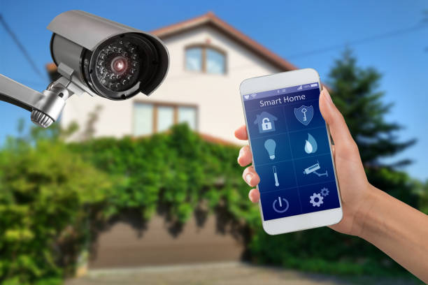 Security camera and smart home app, private house on the background