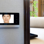 Intercom video door bell on the wall outside modern bedroom