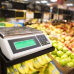 Retail Store Electronic Weighing Scales and the Store Fresh Products in the Background